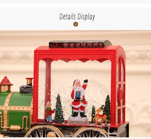 Detail of vintage Christmas steam train ornament with Santa Claus and reindeer display