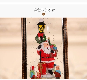 Close-up of internal Christmas scene with Santa Claus and LED glowing glitter water