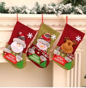 Detailed trio of Christmas stockings with Santa, Snowman and Reindeer on a white fireplace