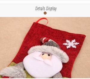 Detail of red burlap Christmas stocking featuring 3D Santa and grey faux fur accents