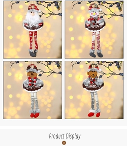 Detail of plush Christmas hanging ornaments with long legs and Navidad wooden signs