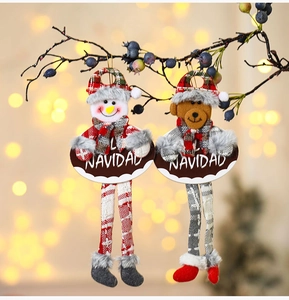 Detail of fabric Christmas ornaments with NAVIDAD signs hanging on decorated branches