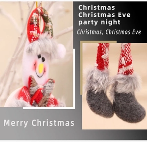 Detail view of plush snowman ornament with red plaid hat and gold lanyard for Christmas tree