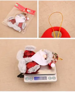 Close-up of fabric Santa Claus hanging ornament featuring festive red and green plaid patterns