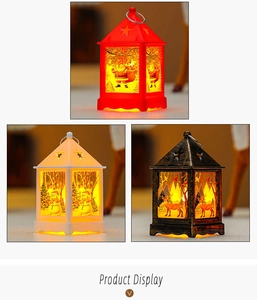 Close-up of LED Christmas lanterns featuring Santa, snowman and deer motifs with warm light