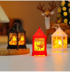 Close-up of vintage mini Christmas lanterns with Santa patterns and warm LED light