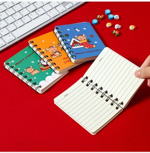 Set of four Christmas spiral notebooks with Santa motifs and lined date inner pages