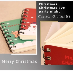 Detail of Christmas A7 spiral notebook showing festive covers and white paper pages