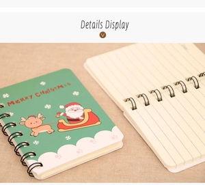 Detail view of A7 Christmas spiral notebook with Santa Claus sleigh and lined paper
