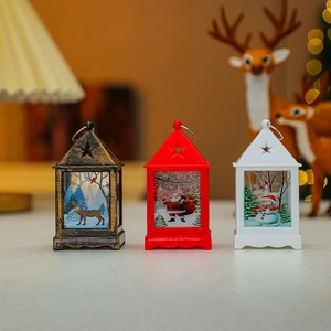 Three Christmas LED lanterns with reindeer and Santa patterns in copper, red, and white