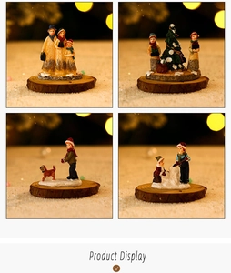 Detailed view of four resin Christmas figurines on rustic wood bases for holiday decor