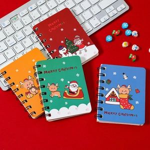 Set of four colorful A7 spiral Christmas notebooks featuring festive cartoon designs