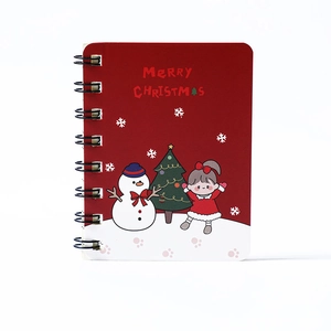 Portable A7 Christmas spiral notebook featuring festive red cover and girl illustration