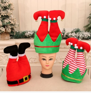Detail of creative Christmas elf and Santa hats with legs and bells for holiday party