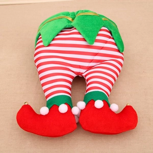 Detail of Christmas elf legs with red and white stripes, green trim, and small golden bells