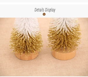 Close-up of 10cm mini Christmas trees with gold glitter and natural wood bases
