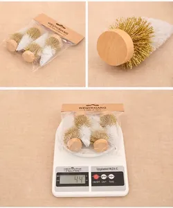 Mini cedar trees detail with wooden bases and golden-white bristles for Christmas decor