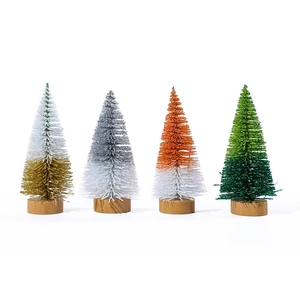 Four mini cedar Christmas trees in gradient colors on round wooden bases for table decor