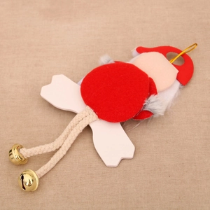 Detail of red felt Christmas pendant with woven rope legs and small golden bells