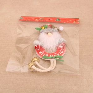 Detailansicht der Weihnachtsmann-Plüschfigur mit Feliz Navidad-Ring in Verpackung
