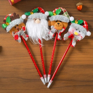 Set of 4 Christmas cartoon pens with Santa, elk, bear and snowman on dark wood background