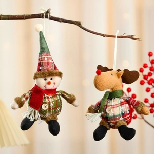 Plaid Christmas plush ornaments featuring snowman and reindeer on rustic branches