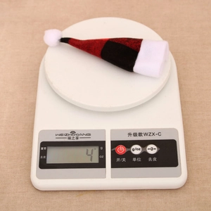 Detailed view of red and black buffalo check Christmas mini hat weighing only 4 grams