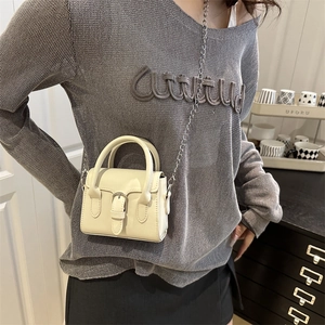 Chic cream mini crossbody bag with silver chain strap and metal buckle for women
