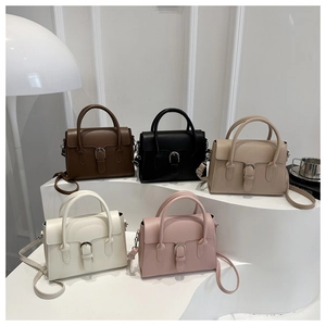 Detail view of stylish small square handbags with horseshoe buckles in five trendy colors