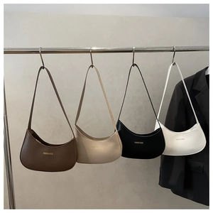 Detailed close-up showing four colors of stylish matte leather hobo bags on a display rack