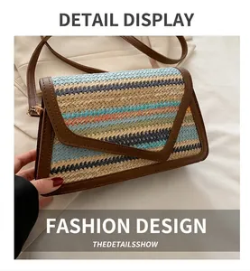 Close-up of woven straw crossbody bag featuring multi-color stripes and leather trim
