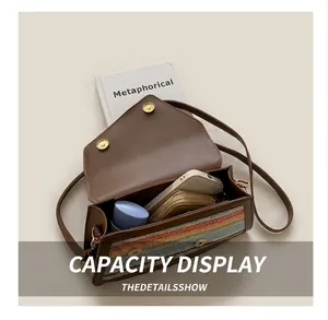 Internal capacity of rainbow straw bag showing space for phone and makeup