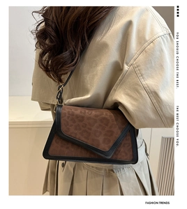 Brown leopard pattern crossbody bag styled with a beige trench coat for a chic daily look