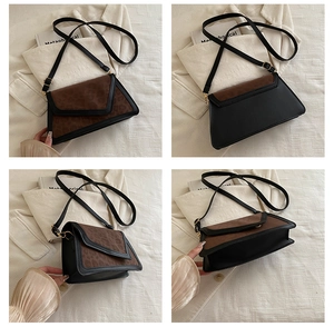 Detailed view of bicolor crossbody bag with animal print and V-shape flap design