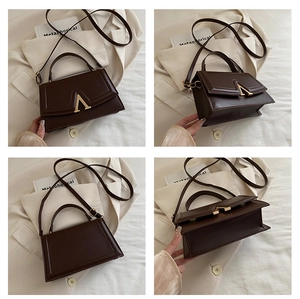Vues détaillées du sac à main marron foncé avec fermoir doré en A et coutures de précision