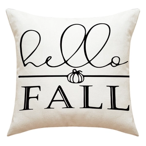 Detail of linen pumpkin pillow cover with black hello FALL text and textured fabric