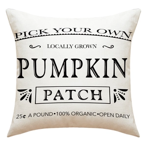 Detail of linen pillowcase with black vintage pumpkin patch print for Thanksgiving decor