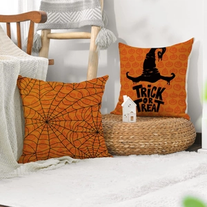Detail of Halloween orange linen pillow covers with spider web and trick or treat designs