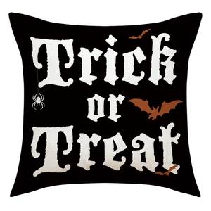 Detail of Halloween Trick or Treat linen pillowcase with black base and bat spider print
