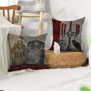 Gothic skull and gravestone linen pillow covers in a cozy home interior setting