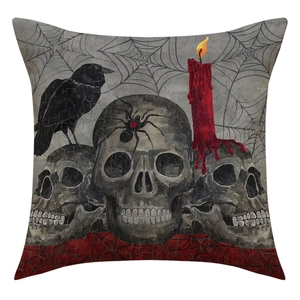 Detailed linen cushion cover featuring skulls, raven, spider and festive candle motifs