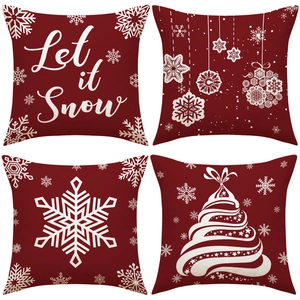 Set of four red Christmas linen pillow covers with snowflakes and holiday tree designs
