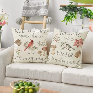 Detailed view of linen Christmas pillow covers with vintage bird and botanical prints