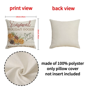 Christmas linen pillow cover 18x18 with festive orange and pinecone print on wood background