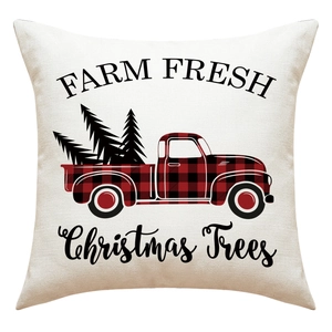 Detail of linen Christmas pillowcase featuring farm fresh vintage truck and trees