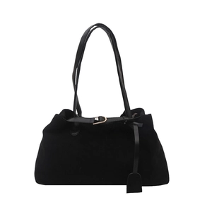 Minimalist black suede tote bag with rose gold hardware and decorative belt detail