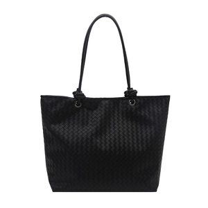 Classic black woven leather tote bag with elegant handles for a minimalist look