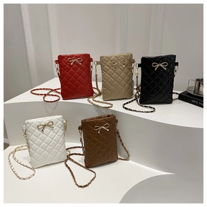 Detail showing five quilted crossbody bags with golden bow buckles and chain straps