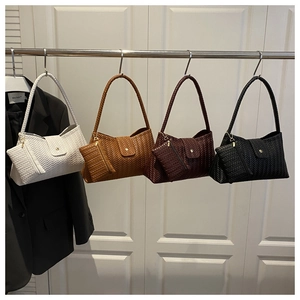 Detail of hand-woven hobo bags in four colors with matching detachable small zip pouches
