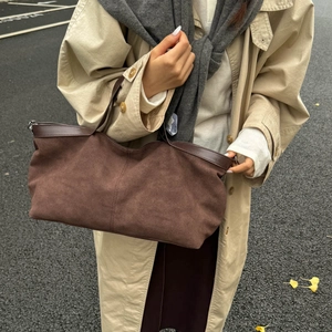 Retro large brown suede tote bag for women shown with autumn trench coat in street style